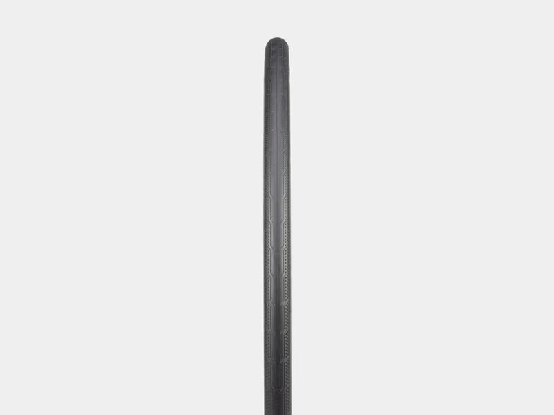 Black cylindrical object on a light gray background