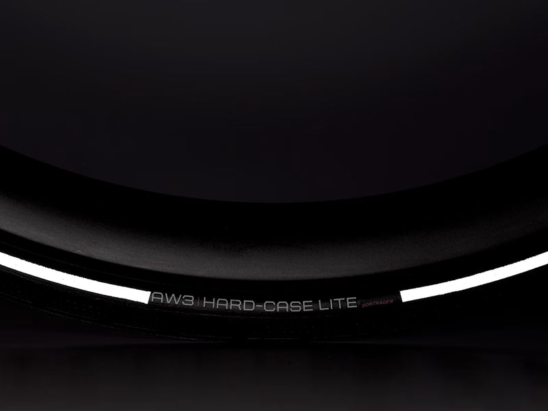 Black tire with white text on a black background