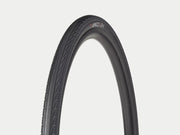 Black bicycle tire on a light gray background