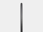 Black cylindrical object on a light gray background