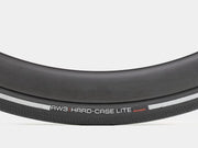 Close-up of a bicycle tire with 'AW3 Hard-Case Lite' branding on a white background