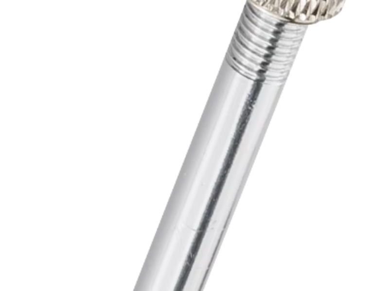 Close-up of a metallic pen on a white background