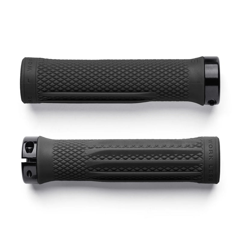 Two black bicycle grips with textured surface on a white background