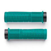 Two teal bicycle grips with black ends on a white background