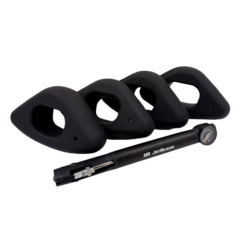 Product shot of four JetBlack Freedom Rocker Feet with the pump on a white background, no packaging included.