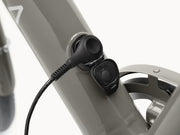Close up of frame charger plug being utilized (Electra Loft Go! 7D EQ Step-Over), gray bike