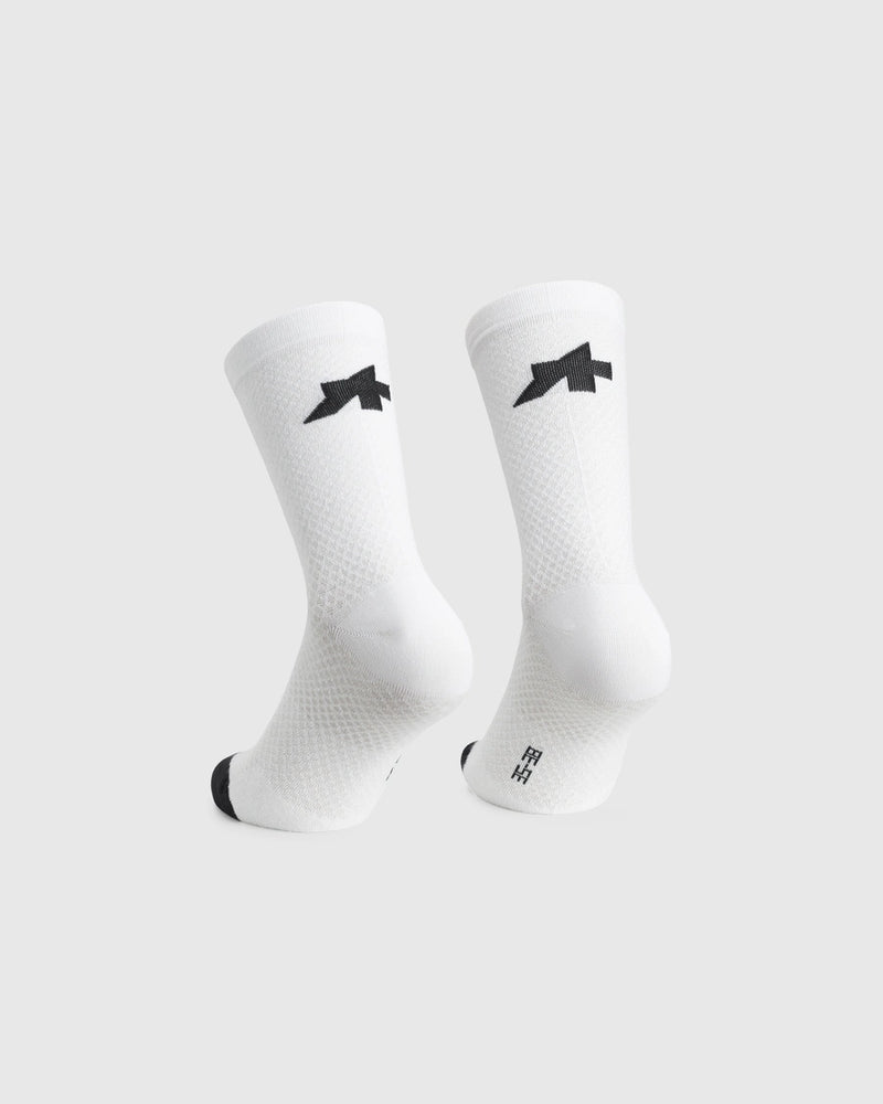 Assos Spring Fall Socks P3 cycling socks in White Series colourway, rear view showing textured breathable fabric, Assos logo below the cuff, black toe reinforcement, and size marking detail.