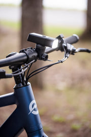 lifestyle image of closeup on bike frame handlebar