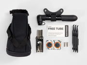 black bag with components against a a light grey background