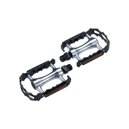 Pair of bicycle pedals with metallic finish on a white background