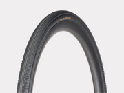 Black bicycle tire with tread pattern on a light gray background