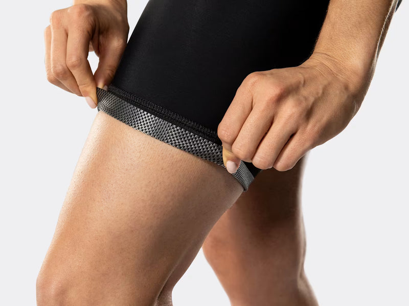 Close-up of Bontrager Anara women's cycling shorts cuff detail, showing the breathable perforated interior fabric, secure leg gripper construction, and moisture-managing performance materials.