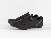 Three-quarter view of paired black Bontrager Circuit road cycling shoes showcasing the lateral BOA dial and strap layout on one shoe alongside the medial profile of the other