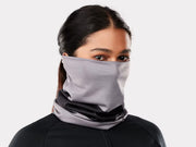 Bontrager Convertible neck gaiter in Black/Charcoal, worn pulled up over the nose with a charcoal and black pattern