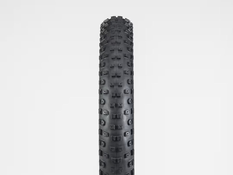 Black tire with tread pattern on a white background