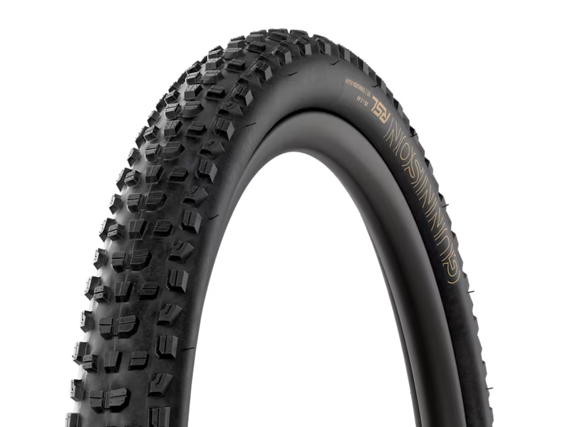 A black mountain bike tire with aggressive knobby tread, featuring gold lettering that reads 'MOSPINNING' and 'FZL' on the sidewall, shown against a solid white background.