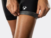 Close-up of the black Bontrager Meraj Women's Cycling Short leg cuff, showing breathable perforated mesh fabric, premium stitching details and white Bontrager logo above the hem.
