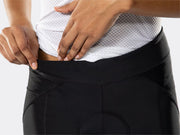 Close-up of the black Bontrager Meraj Women's Cycling Short waistband, highlighting the wide supportive waistband, stretch fabric, contoured panel construction, ventilated mesh side panels and performance cycling fit.