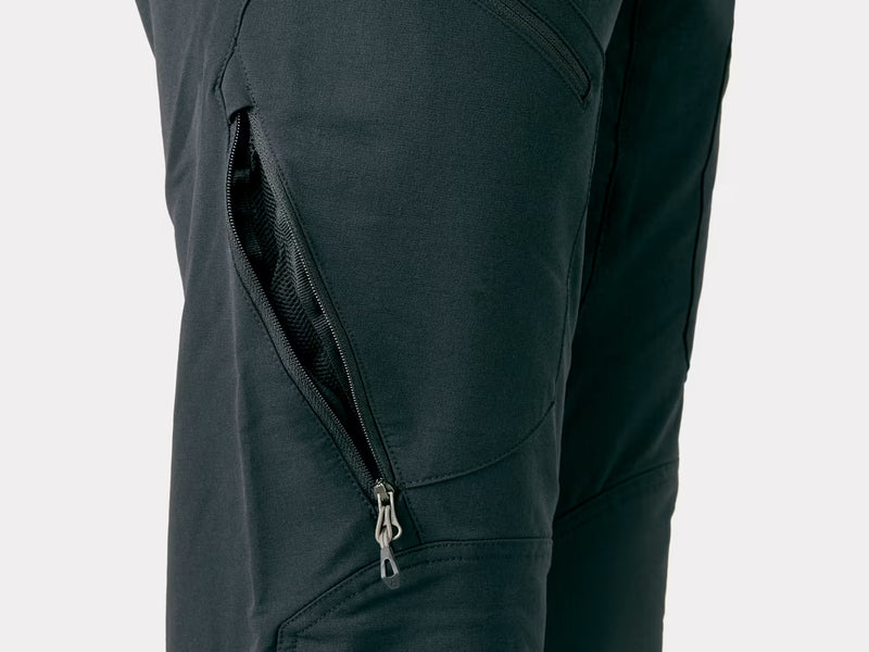 Bontrager OMW softshell pant in black, close-up of knee with zippered leg pocket and stitching