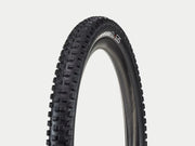Black tire with tread pattern on a white background