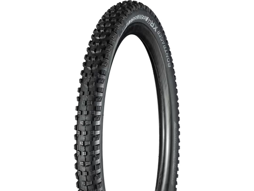 Black bicycle tire with tread pattern on a white background