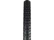 Close-up of a black tire tread pattern on a white background