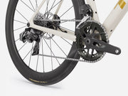 Close-up of a bicycle wheel and chain on a white background