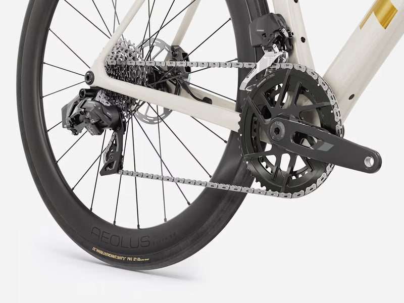 Close-up of a bicycle wheel and chain on a white background