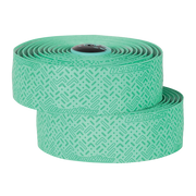 Two rolls of green tape with a pattern on a white background