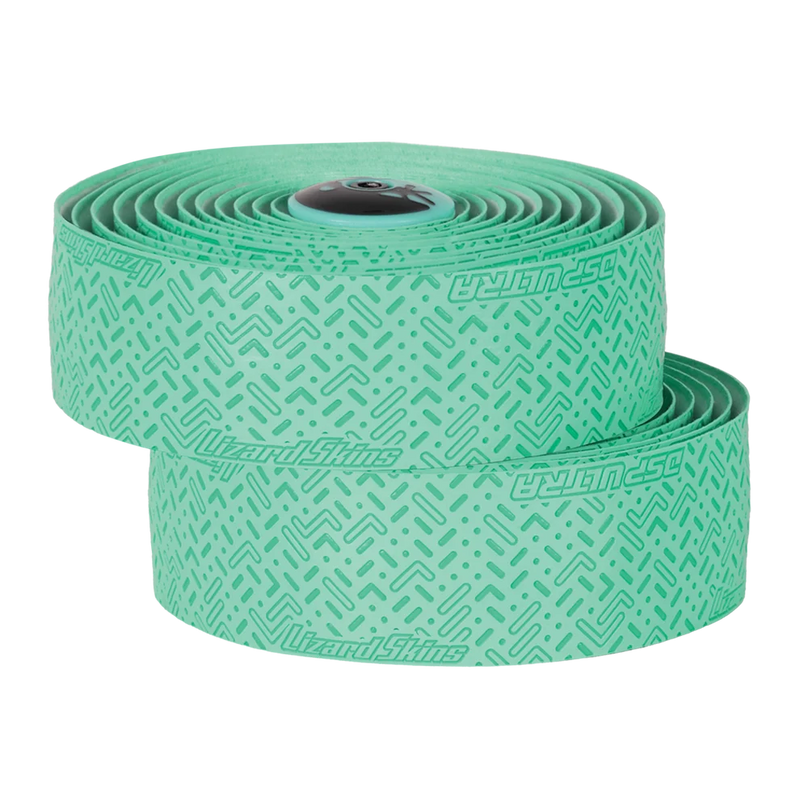 Two rolls of green tape with a pattern on a white background