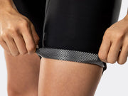 Close-up of Bontrager Circuit women's cycling bib shorts leg cuff, showing breathable perforated interior fabric, secure compression cuff, and premium performance materials designed for all-day comfort.