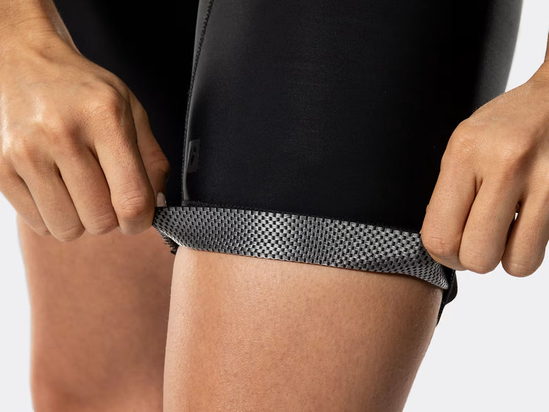 Close-up of Bontrager Circuit women's cycling bib shorts leg cuff, showing breathable perforated interior fabric, secure compression cuff, and premium performance materials designed for all-day comfort.