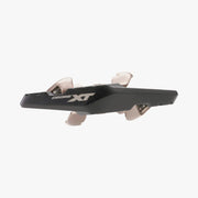 Black and beige bicycle component with 'Deore XT' branding on a white background