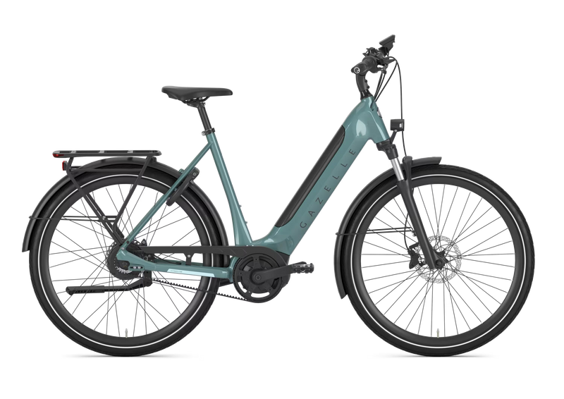 A low step electric bicycle in a muted teal frame with black components, fenders, and tires, shown from a side profile on a solid white background.