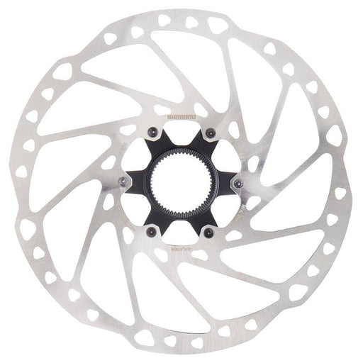 Bicycle disc brake rotor on a white background