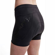 Craft Essence Hot Pants W black women’s cycling shorts in a three-quarter side view, featuring the mesh logo panel, waistband stitching and silicone leg gripper.