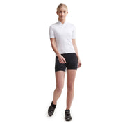Woman wearing black Craft Essence Hot Pants W cycling shorts with an athletic top, shown from head to toe to highlight the fitted, extra-short cycling style.