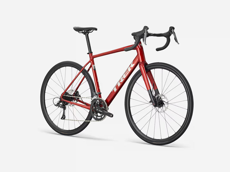 Red endurance road bicycle on a white background