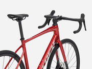 Red bicycle with black components on a white background