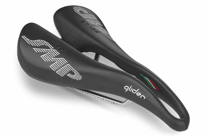 Selle SMP Glider Saddle in black with white stitched logos and central ergonomic cutout, shown at a front diagonal angle.