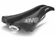 Selle SMP Glider Saddle in black with white stitched logos and raised rear section, shown at a back diagonal angle.