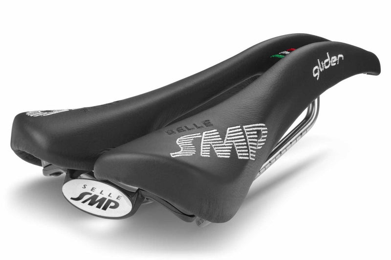Selle SMP Glider Saddle in black with white stitched logos and raised rear section, shown at a back diagonal angle.