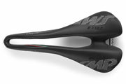 Selle SMP Glider Saddle top view with central ergonomic cutout, white stitched logos, and curved shape, tip facing left.