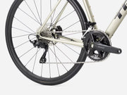 Close-up of a bicycle's rear wheel and gear system on a white background