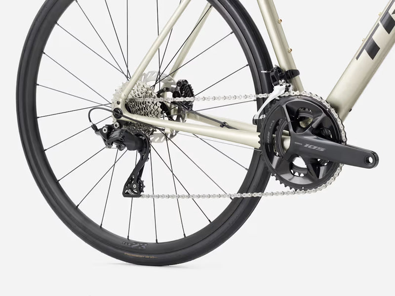 Close-up of a bicycle's rear wheel and gear system on a white background