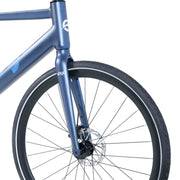 Close-up of the front wheel and CST tire on the blue Ebgo Modal Sport TB electric bike.