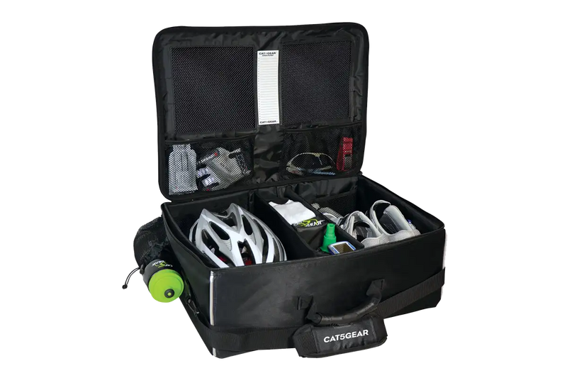 An open CAT5GEAR bicycle BAG with a black exterior, black interior lining, and various CYCLING items organized inside, including a white bicycle helmet, a green bottle, shoes, gloves, shown on a white background.