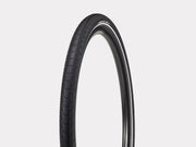 Black bicycle tire on a light gray background
