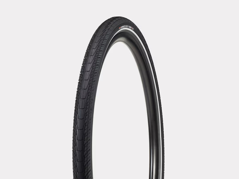 Black bicycle tire on a light gray background