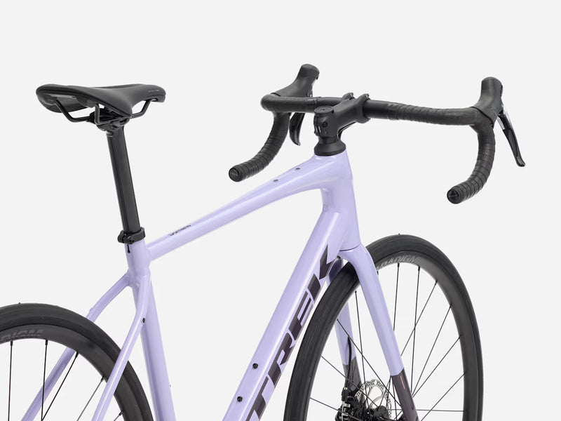 Purple endurance road bicycle with black components on a white background